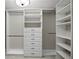 Custom walk-in closet with ample shelving and drawer space for optimal organization at 5104 E Longboat Blvd, Tampa, FL 33615