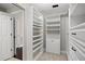 Bright and organized walk-in closet provides optimal storage with extensive shelving at 5104 E Longboat Blvd, Tampa, FL 33615