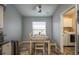 Bright dining area with a wooden table, comfortable seating, and natural light at 632 Lake Cypress Cir, Oldsmar, FL 34677