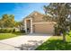 Charming single-story home with well-maintained landscaping and a two-car garage at 632 Lake Cypress Cir, Oldsmar, FL 34677