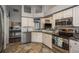 Well-equipped kitchen with granite countertops, stainless steel appliances, and ample cabinet space at 632 Lake Cypress Cir, Oldsmar, FL 34677
