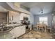 Bright kitchen featuring granite countertops, stainless steel appliances, and an adjacent dining area at 632 Lake Cypress Cir, Oldsmar, FL 34677