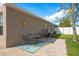 Back patio featuring table, chairs, and paved brick is perfect for entertaining and outdoor enjoyment at 632 Lake Cypress Cir, Oldsmar, FL 34677