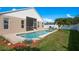 Backyard swimming pool with nice landscaping and an outdoor screened-in patio at 632 Lake Cypress Cir, Oldsmar, FL 34677