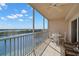 Screened balcony with tile flooring offers panoramic views of the lake, blue skies and beautiful landscape at 6475 Shoreline Dr # 5403, St Petersburg, FL 33708