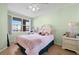 Cozy bedroom with a large window, offering plenty of natural light at 6475 Shoreline Dr # 5403, St Petersburg, FL 33708