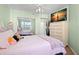 Bedroom featuring mirrored closet doors and a large dresser at 6475 Shoreline Dr # 5403, St Petersburg, FL 33708