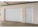 Attached garage with a white door and a numbered entry door within a condominium complex at 6475 Shoreline Dr # 5403, St Petersburg, FL 33708