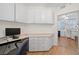 Home office with custom desk and cabinets, offering ample workspace at 6475 Shoreline Dr # 5403, St Petersburg, FL 33708