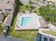 Pool and patio area with surrounding deck, lounge chairs, and umbrellas for outdoor relaxation at 6475 Shoreline Dr # 5403, St Petersburg, FL 33708