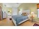 Comfortable bedroom with natural light, a vaulted ceiling, a ceiling fan, and easy access to the ensuite bathroom at 7201 15Th Ne Ct, St Petersburg, FL 33702