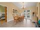Cozy dining area with stylish lighting, comfortable seating, and elegant decor overlooking the pool at 7201 15Th Ne Ct, St Petersburg, FL 33702
