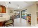 Breakfast nook featuring large windows overlooking the pool, tile floors, and granite countertops at 7201 15Th Ne Ct, St Petersburg, FL 33702