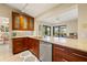 Well-designed kitchen features granite countertops, stainless steel appliances, and seamless flow to the outdoors at 7201 15Th Ne Ct, St Petersburg, FL 33702