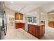 Open concept kitchen with granite countertops, stainless steel appliances, and tile flooring at 7201 15Th Ne Ct, St Petersburg, FL 33702