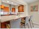 Open kitchen with granite countertops, stainless steel appliances, and seating at the breakfast bar at 7201 15Th Ne Ct, St Petersburg, FL 33702
