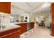 Bright kitchen featuring granite countertops, stainless steel appliances, and seamless flow to the living area at 7201 15Th Ne Ct, St Petersburg, FL 33702
