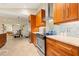 Contemporary kitchen featuring stainless steel appliances, tile backsplash, and custom cabinets at 7201 15Th Ne Ct, St Petersburg, FL 33702