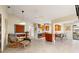 Bright and airy living room flows into the kitchen featuring stainless steel appliances and a breakfast bar at 7201 15Th Ne Ct, St Petersburg, FL 33702