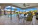 Inviting screened patio with ample seating, overlooking a sparkling pool and landscaped backyard at 7201 15Th Ne Ct, St Petersburg, FL 33702