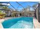 Inviting screened-in pool area, perfect for relaxation and entertainment with ample seating at 7201 15Th Ne Ct, St Petersburg, FL 33702