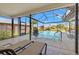 Relaxing screened-in lanai with a sparkling pool and comfortable lounge chairs. Enjoy the Florida lifestyle in your backyard at 7201 15Th Ne Ct, St Petersburg, FL 33702