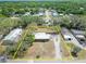 This aerial view highlights the property boundaries, nestled in a serene community with lots of trees at 827 Louise St, Brandon, FL 33511