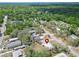 Aerial shot of home in serene community offering peaceful living, with mature trees enhancing the picturesque neighborhood at 827 Louise St, Brandon, FL 33511