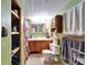 Bathroom with a colorful shower curtain and plenty of storage space in the shelves at 827 Louise St, Brandon, FL 33511