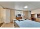 Spacious bedroom featuring wood-look floors and walk in closet at 827 Louise St, Brandon, FL 33511
