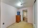 Modest bedroom with neutral carpeting and a storage dresser at 827 Louise St, Brandon, FL 33511