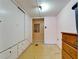 Bedroom featuring built in wardrobe, dresser, and an attached bathroom/closet area at 827 Louise St, Brandon, FL 33511