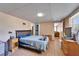 Spacious bedroom featuring wood-look floors and walk in closet at 827 Louise St, Brandon, FL 33511