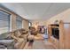 Comfortable living room with cozy seating, wood-look floors, and ample natural light at 827 Louise St, Brandon, FL 33511