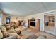 Comfortable living room with cozy seating, wood-look floors, and ample natural light at 827 Louise St, Brandon, FL 33511
