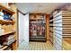 Organized storage room with shelves, boxes, and durable flooring at 827 Louise St, Brandon, FL 33511