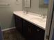 Bathroom featuring dual sinks, vanity, updated fixtures, and modern countertop at 832 S Parsons Ave, Brandon, FL 33511