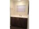 Bathroom features modern vanity with sleek dark wood cabinets and bright countertop at 832 S Parsons Ave, Brandon, FL 33511