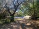 Spacious property featuring multiple storage units and mature trees at 832 S Parsons Ave, Brandon, FL 33511