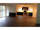 Contemporary kitchen featuring stainless steel appliances, black cabinets, and an island at 832 S Parsons Ave, Brandon, FL 33511