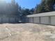 Angle view of Storage Units with garage style doors and parking area at 832 S Parsons Ave, Brandon, FL 33511