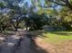 Exterior view of home on large lot, featuring a long driveway and single story layout at 832 S Parsons Ave, Brandon, FL 33511