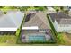 Overhead shot of the property featuring a screened-in pool and well-maintained backyard at 1106 Tracey Ann Loop, Seffner, FL 33584