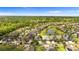 Aerial view of the home, showcasing its location within a serene, tree-lined community at 1106 Tracey Ann Loop, Seffner, FL 33584