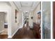 Spacious foyer with hardwood floors, a decorative display niche, and a view towards the front door at 1106 Tracey Ann Loop, Seffner, FL 33584