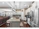 This gourmet kitchen has stainless appliances, a granite island and decorative touches at 1106 Tracey Ann Loop, Seffner, FL 33584