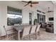 Spacious covered patio with an outdoor dining table and additional seating area at 1106 Tracey Ann Loop, Seffner, FL 33584