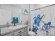 Bathroom with granite countertops, a white sink, and a turtle themed shower curtain at 11295 Timber Grove Ln, Brooksville, FL 34613