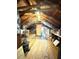 Spacious attic features exposed beams, a wooden floor, and abundant storage space at 115 21St Ne Ave, St Petersburg, FL 33704