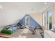 Attic gym and sitting area with light colored walls, carpet flooring, and plenty of natural light at 115 21St Ne Ave, St Petersburg, FL 33704